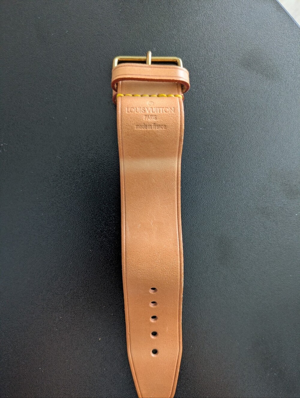 Louis Vuitton leather handle fastener or "poignée" in brown vachetta